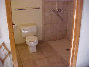 after- homeowner can take her wheelchair into the shower.